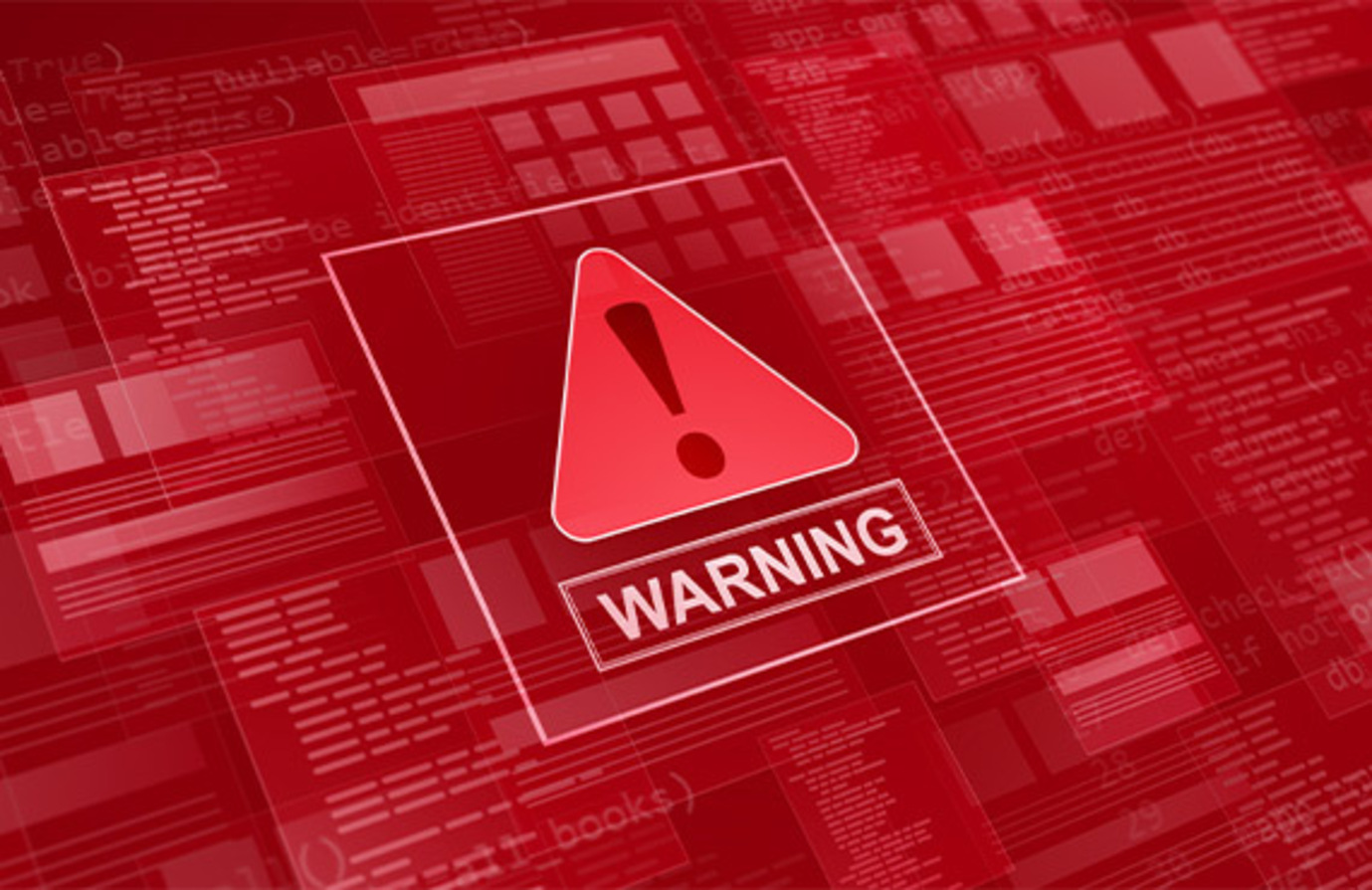 Red warning sign on computer screen - symbolizing potential dangers and risks in the threat landscape.