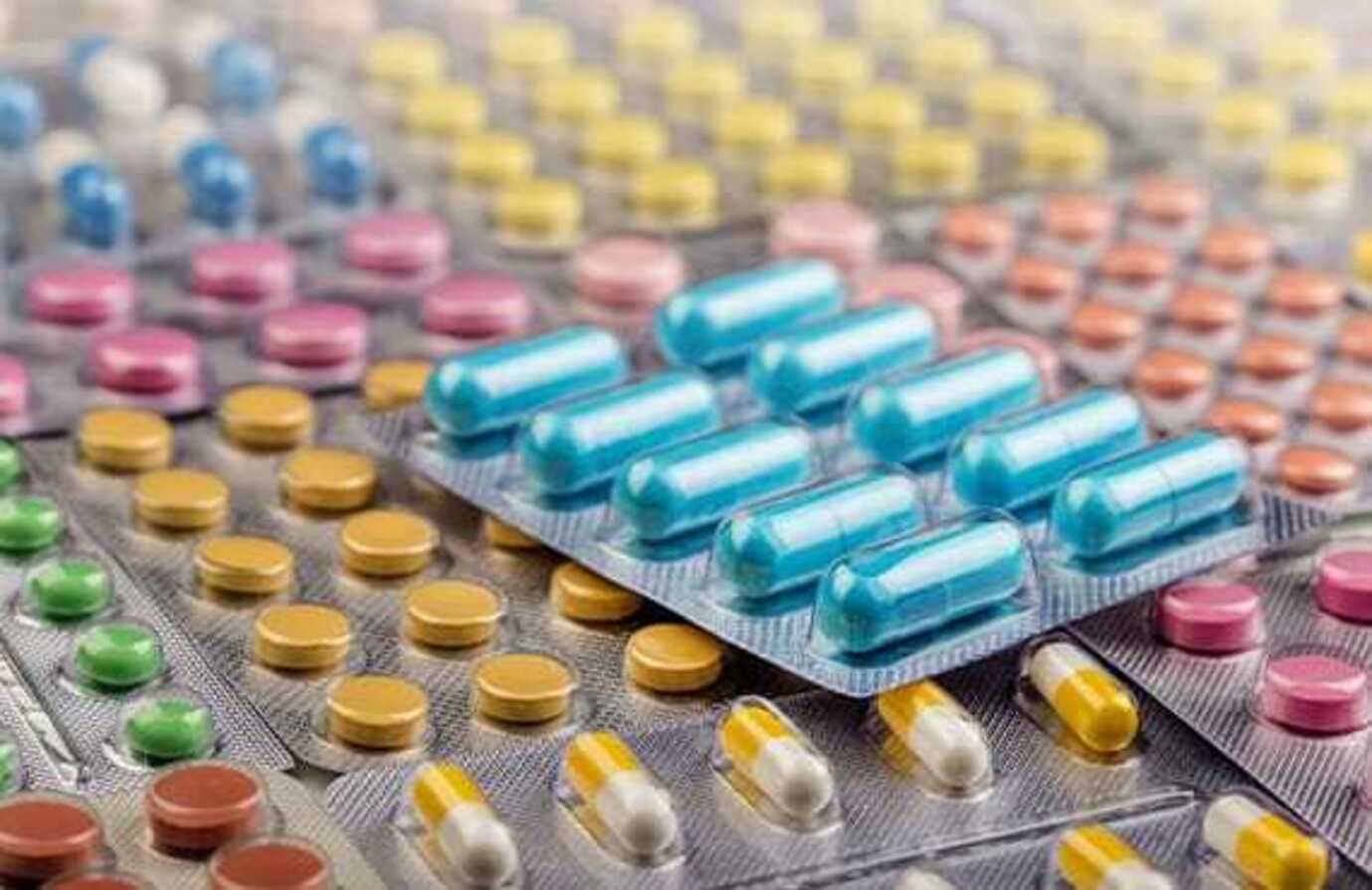 Pills in blister packs manufactured using batch processing.