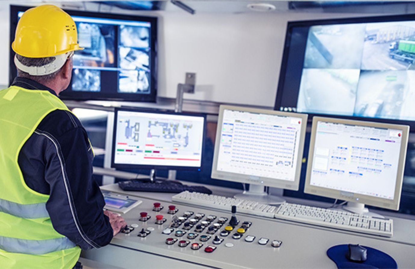 A quality control inspector in a control room. The image illustrates the implementation of a SIS system, emphasizing its role in ensuring safety and compliance.