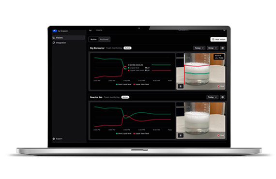 Revolutionizing Foam Detection in Bioprocessing and Beyond A laptop displaying a dashboard monitoring bioreactors with graphs and video feeds.